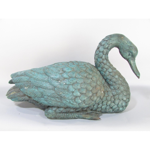 591 - A bronze study of a goose, life size, with verdigris finish, 50cm wide.