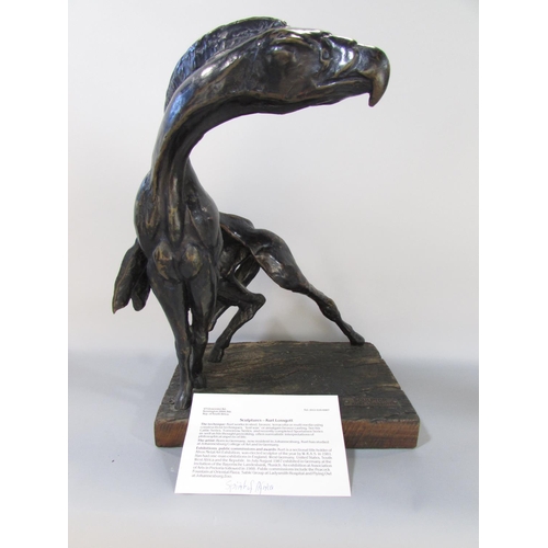 592 - A Bronzed sculpture “The Spirit Of Africa “ Gryphon, raised on a wooden base, bearing a label Sculpt... 