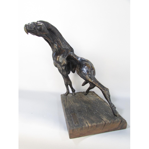 592 - A Bronzed sculpture “The Spirit Of Africa “ Gryphon, raised on a wooden base, bearing a label Sculpt... 