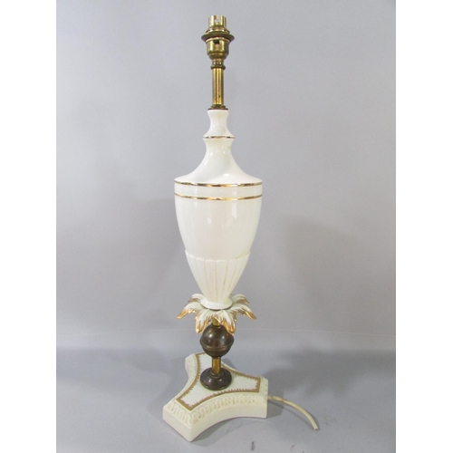 597 - A pair of white and gilt vase shaped table lamps and a pair of pleated shades.