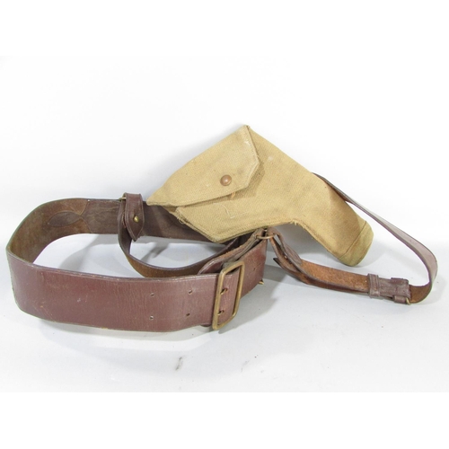 609 - A British Army issue brown leather Sam Brown belt and shoulder strap together with a khaki canvas pi... 