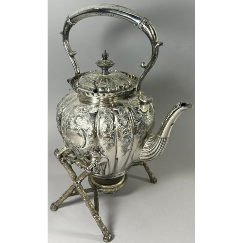 206 - A Silver plated spirit kettle on branch like supports and burner below.