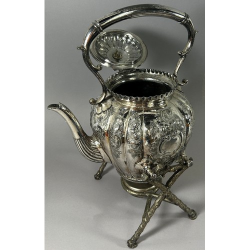 206 - A Silver plated spirit kettle on branch like supports and burner below.