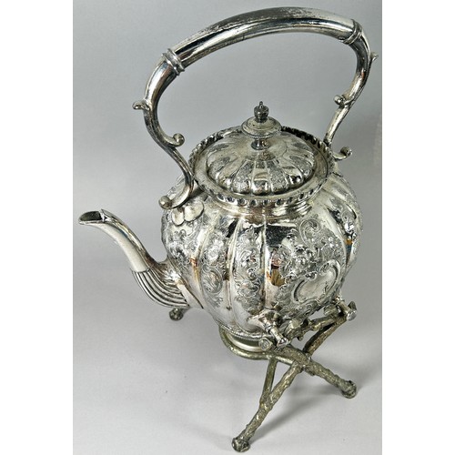 206 - A Silver plated spirit kettle on branch like supports and burner below.