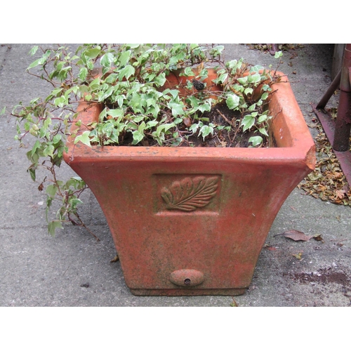 1003 - A weathered terracotta squat oviform garden planter, 34 cm high x 55 cm diameter together with three... 