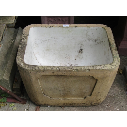 1025 - A weathered buff glazed sink /basin of tapering rectangular form, with glazed interior and moulded c... 