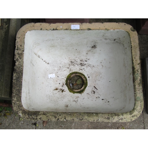 1025 - A weathered buff glazed sink /basin of tapering rectangular form, with glazed interior and moulded c... 