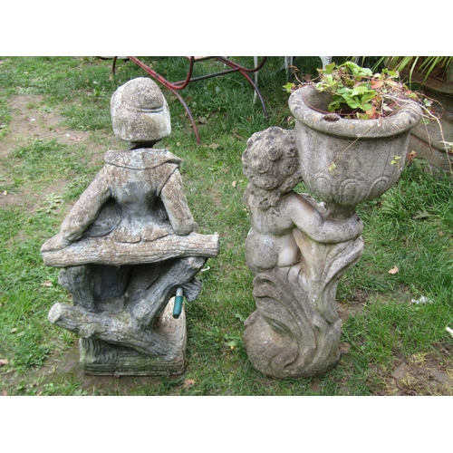 1057 - A weathered cast composition stone garden water feature in the form of a boy standing beside a rusti... 