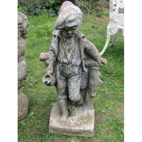 1057 - A weathered cast composition stone garden water feature in the form of a boy standing beside a rusti... 