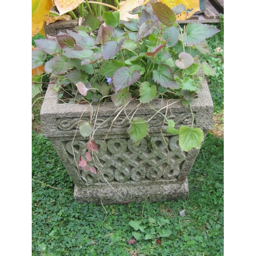 1065 - A pair of weathered composition stone planters of tapering squared form with Celtic knot moulded det... 