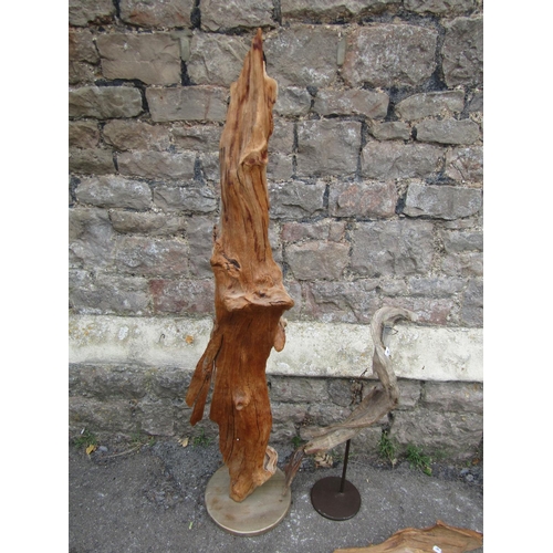 1098 - A drift wood sculpture mounted on a circular platform base, 124 cm high together with a selection of... 