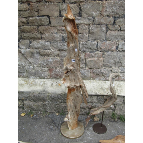 1098 - A drift wood sculpture mounted on a circular platform base, 124 cm high together with a selection of... 