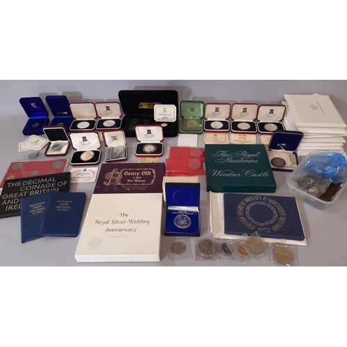 396 - A collection of commemorative / collectable coins and silver ingots to include cased Pobjoy mint cro... 