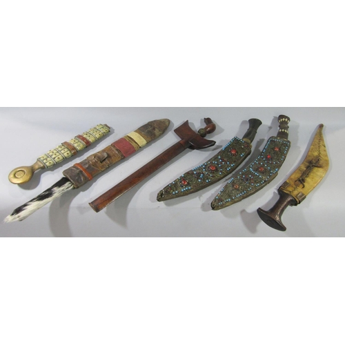 708 - An Indonesian Keris Keris sword dagger, Moroccan Nimeha dagger - sword, two Nepalese Kukri with bead... 