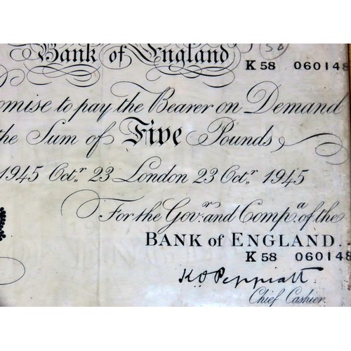 442 - Bank of England, a 1945 white £5 note, serial number k58 060148. Later framed.