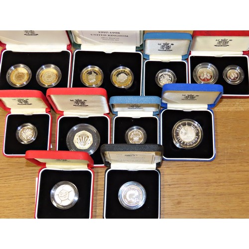 432 - A collection of 39 individually boxed silver proof coins, to include Royal Mint proof Crowns, £2, £1... 