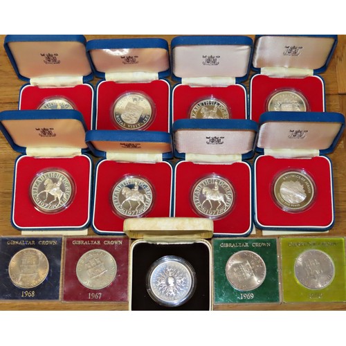 392 - Royal Mint boxed commemorative Crowns and other examples to include Jersey, Guernsey, Gibraltar Crow... 