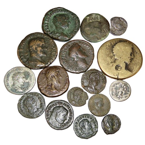 312 - A collection of Roman AE coins, including Sestertius, silver Antoninianus, a Republic Denarius and o... 