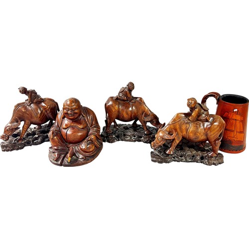 733 - Three South East Asian carved hard wood of farmers riding water buffalo, wood carving of Buddha, a l... 