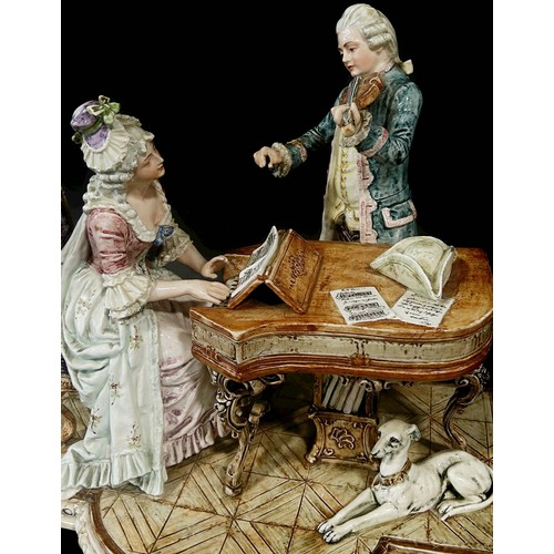 10 - A late 19th century German porcelain group - romantic scene with female pianist and male violinist i... 