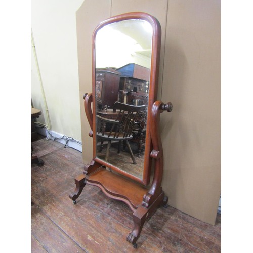 1613A - A 19th century mahogany cheval mirror on platform base, 163cm high x 95cm wide x 55cm deep