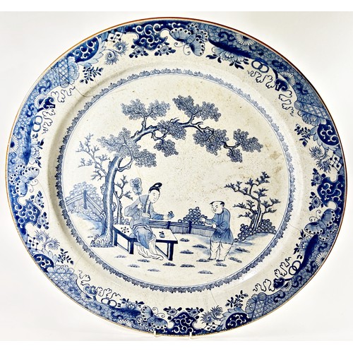 72A - A very large Chinese 18th century export blue and white porcelain dish with a central garden design ... 