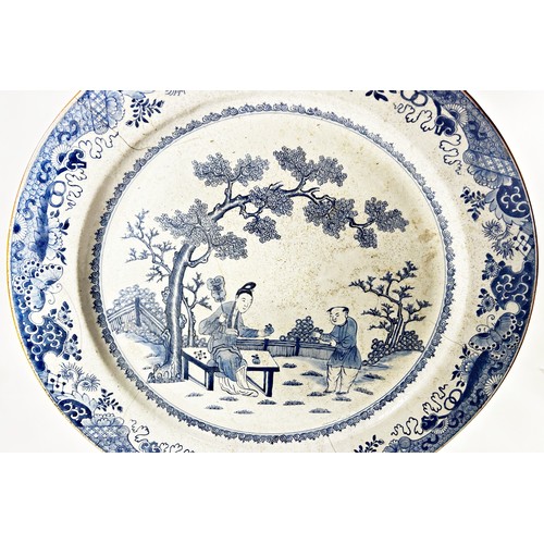 72A - A very large Chinese 18th century export blue and white porcelain dish with a central garden design ... 