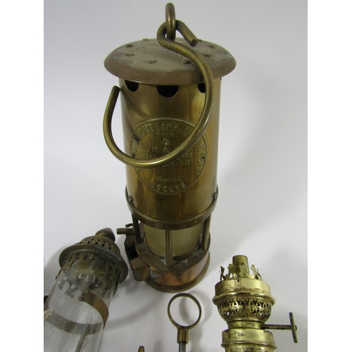 765 - A brass miners lamp, two carriage lamps GWR, three ships cabin lamps on gimble mounts, 19th century ... 