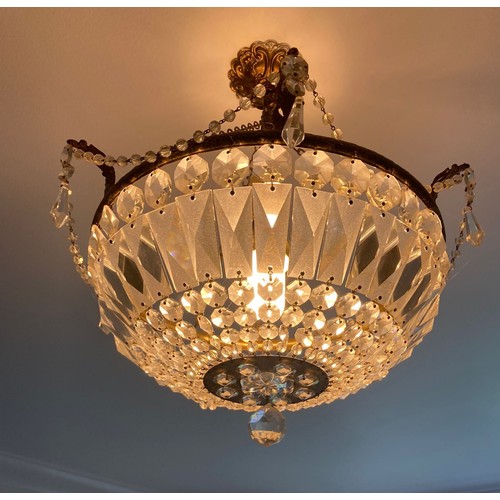 744 - Three Regency style brass ring chandeliers hung with facetted cut crystal  bag 33cm diameter