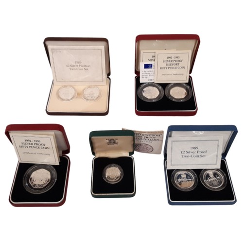 404 - Elizabeth II, Royal Mint cased commemorative silver coins to include 1983 Silver Proof £1 Coin, 1989... 