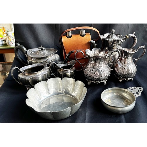 193 - A pair of  three-piece silver plated tea services, a pewter porringer bowl, a lightly hammered pewte... 