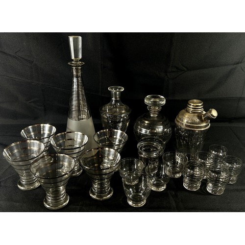 161 - A silver hooped Art Deco cocktail set with shaker, decanters, and a selection of glasses to match, t... 