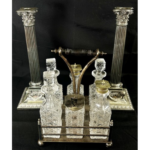 192 - A Pair of early 20th century silver plated Corinthian Column candlesticks raised on garland and rams... 