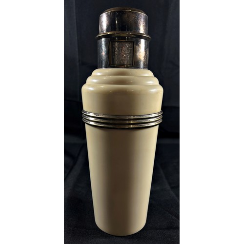 194 - A Classic Art Deco Cream Bakelite and Silver Plated 'The Master Incolor Cocktail Shaker', with eight... 