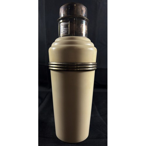 194 - A Classic Art Deco Cream Bakelite and Silver Plated 'The Master Incolor Cocktail Shaker', with eight... 