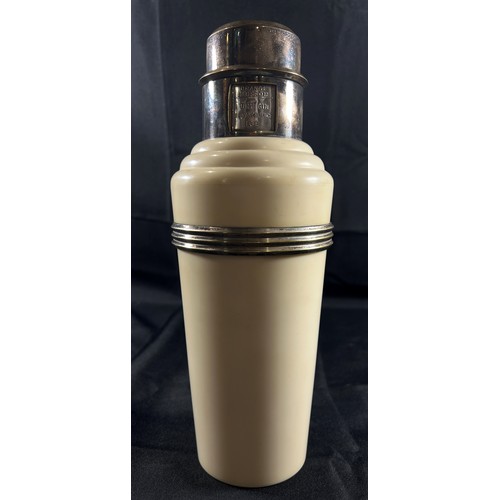 194 - A Classic Art Deco Cream Bakelite and Silver Plated 'The Master Incolor Cocktail Shaker', with eight... 