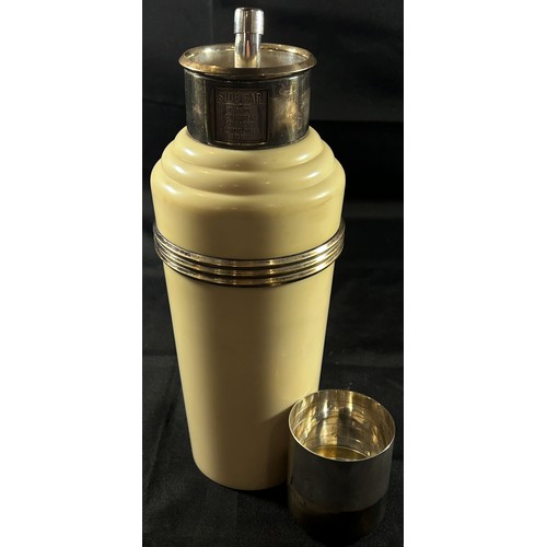 194 - A Classic Art Deco Cream Bakelite and Silver Plated 'The Master Incolor Cocktail Shaker', with eight... 