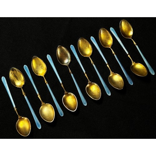 204 - Twelve Scandinavian blue enamel and silver gilded teaspoons stamped 925, HIH, 9.5cm long, 4.5oz appr... 