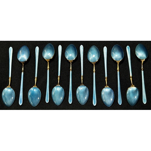 204 - Twelve Scandinavian blue enamel and silver gilded teaspoons stamped 925, HIH, 9.5cm long, 4.5oz appr... 