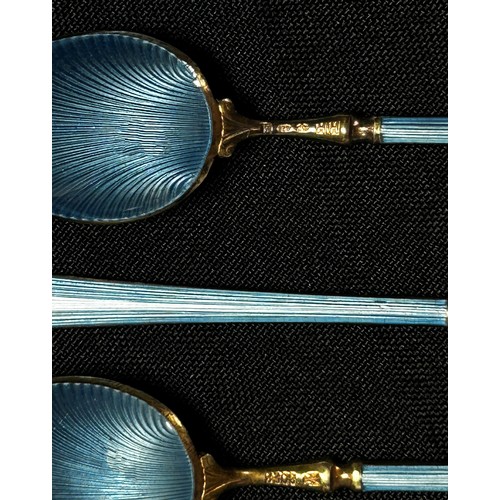 204 - Twelve Scandinavian blue enamel and silver gilded teaspoons stamped 925, HIH, 9.5cm long, 4.5oz appr... 