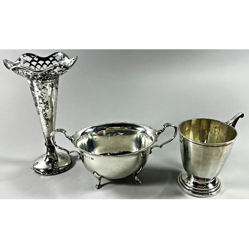 209 - A silver twin handled sugar bowl, a silver cup bearing the name 'Ann', and a weighted posy vase, 9.4... 