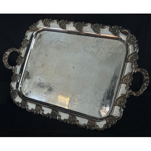 196 - A large late 19th century silver plated tray with scrolling floral garlands, 71cm handle to handle x... 