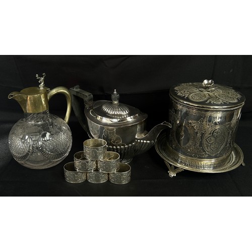 193 - A silver plated biscuit barrel, together with a teapot, cased set of six quality napkin rings, a cut... 