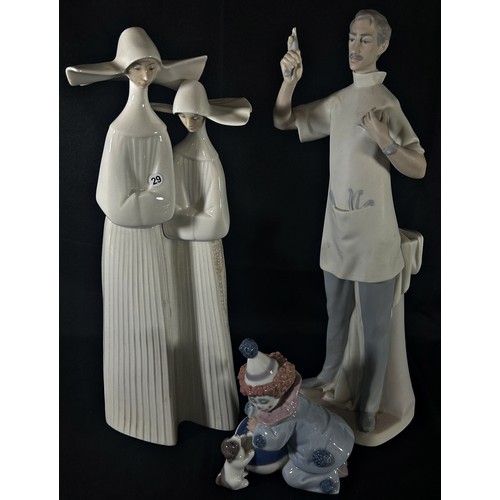 67 - Three pieces of Lladro comprising a figure of a dentist, two nuns and a clown