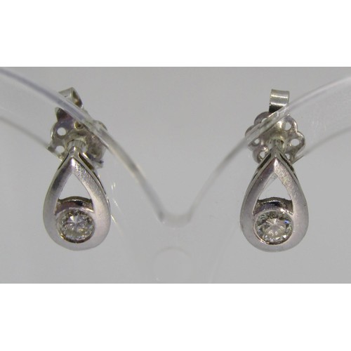 242 - Pair of 18ct white gold diamond stud earrings of pear shape, 0.15ct each approx, maker 'ALd', 2.3g