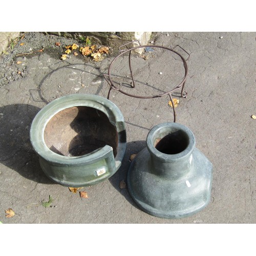 1010 - A small painted two sectional clay chimenea raised on aa simple iron stand, 72cm high