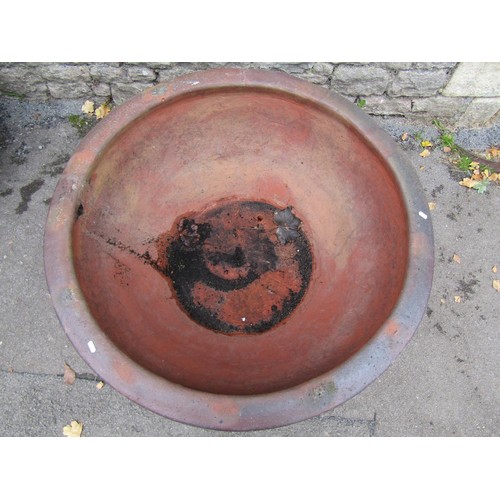 1032 - A large matt glazed terracotta planter of circular tapered ribbed for 44cm high x 100cm diameter, to... 