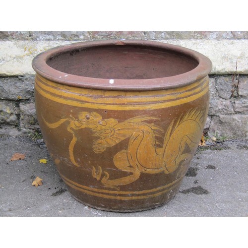 1032 - A large matt glazed terracotta planter of circular tapered ribbed for 44cm high x 100cm diameter, to... 