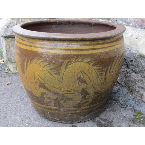 1032 - A large matt glazed terracotta planter of circular tapered ribbed for 44cm high x 100cm diameter, to... 