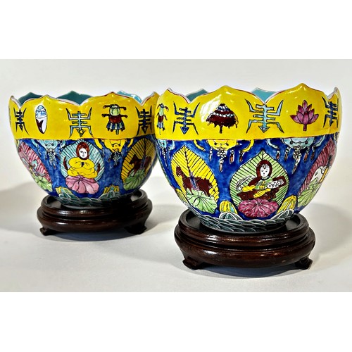 76 - A pair of Chinese lotus bowls, each decorated with figures and auspicious symbols, with apocryphal r... 